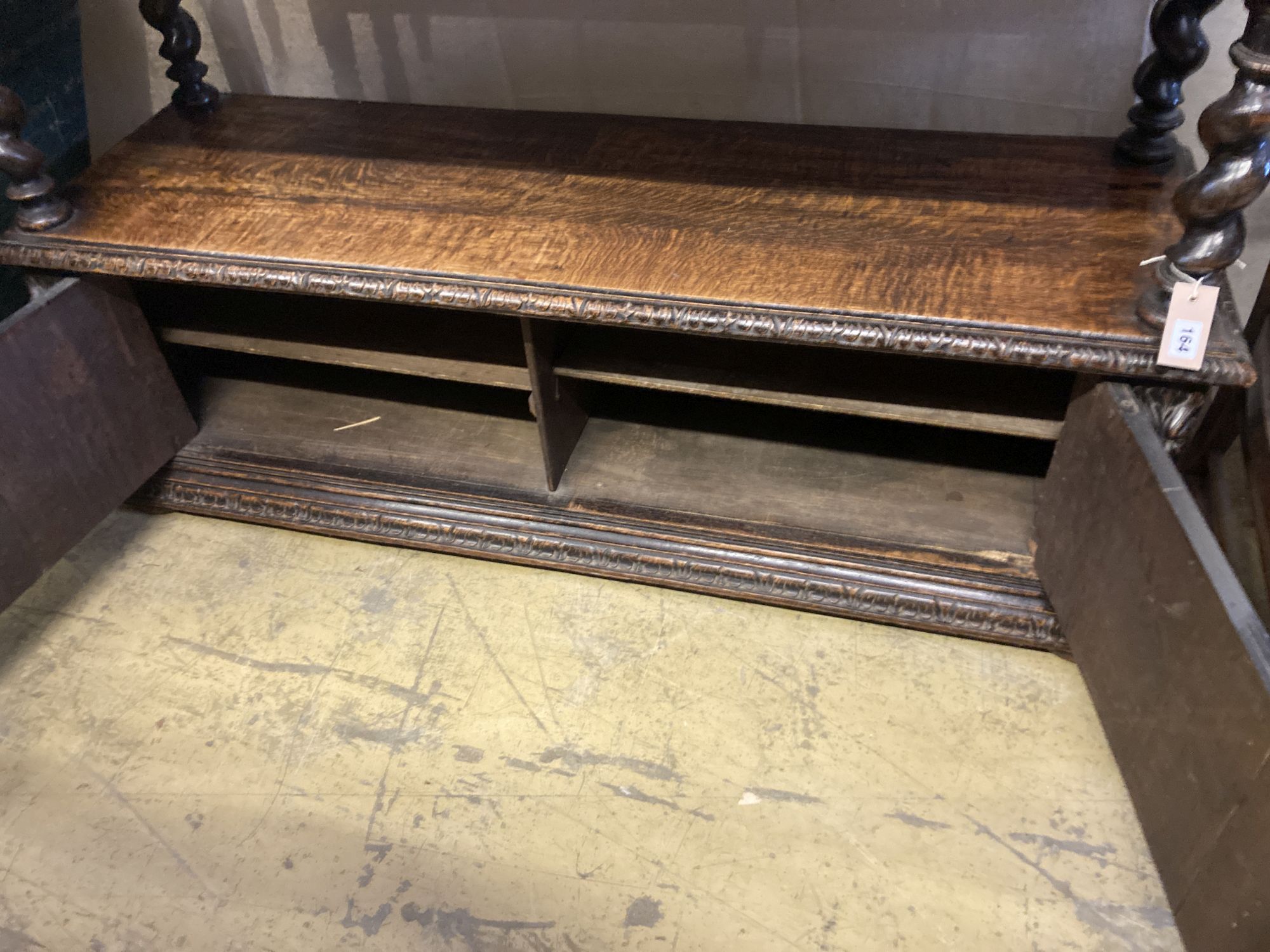 A late 19th century Flemish carved oak buffet, width 136cm, depth 40cm, height 94cm